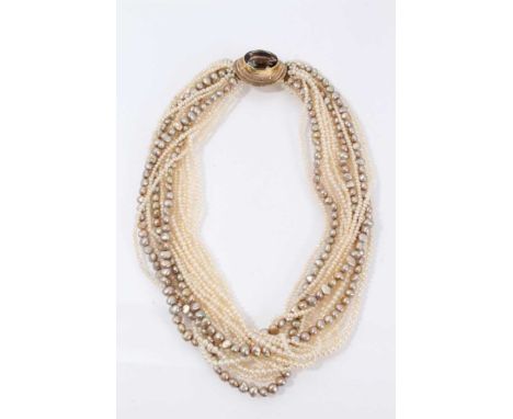 Cultured pearl torsade necklace with a multi-string of cultured pearls with yellow metal and citrine clasp