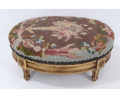 19th century tapestry upholstered giltwood footstool, oval form, reeded frieze with rosette tablet headed fluted legs, 32cm w