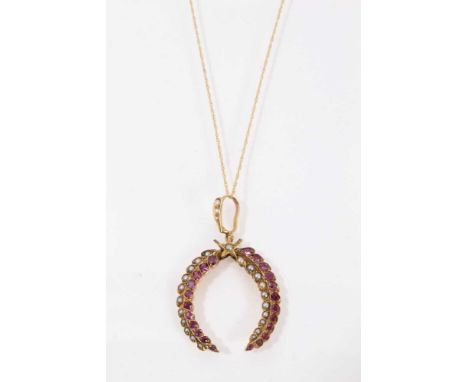 Edwardian ruby and seed pearl pendant, the stylised wreath with central star, on a later 9ct gold chain