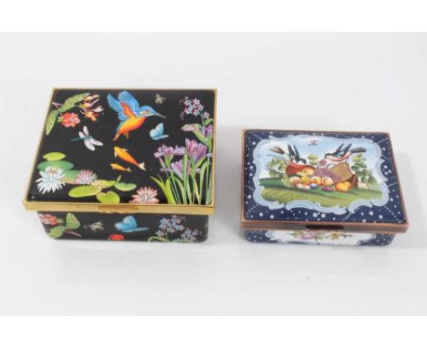 Two large Halcyon days enamel boxes, the first decorated with flora and fauna on a black ground, 9cm wide, the second in the 