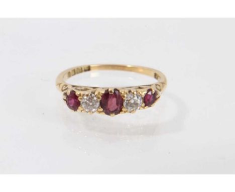 Early 20th century 18ct gold ruby and diamond five stone ring with three oval mixed cut rubies interspaced by two old cut dia