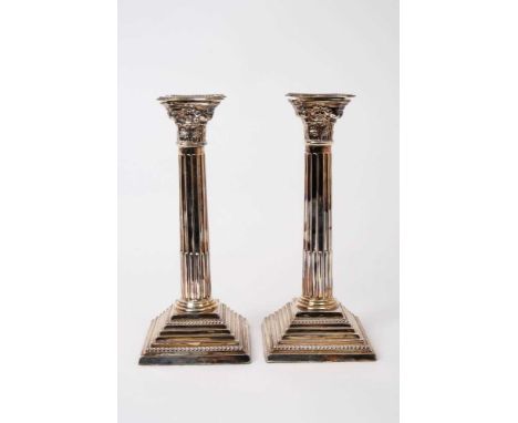 Pair Georgian-style silver Corinthian column candlesticks on stepped bases (London 1962), weighted, 24cm