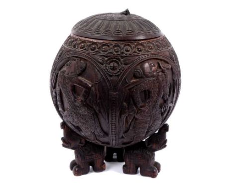 19th century Indian carved coconut tea caddy, the cover relief carved with peacock, the body carved with an continuous arcade
