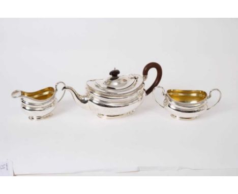 Edwardian silver three piece tea set - comprising teapot of oval bellied form, gadrooned borders, fruitwood loop handle, hing