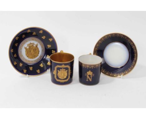 Two 19th century Sèvres-style cabinet cups and saucers decorated with the Imperial motifs of Napoleon I, one with the initial