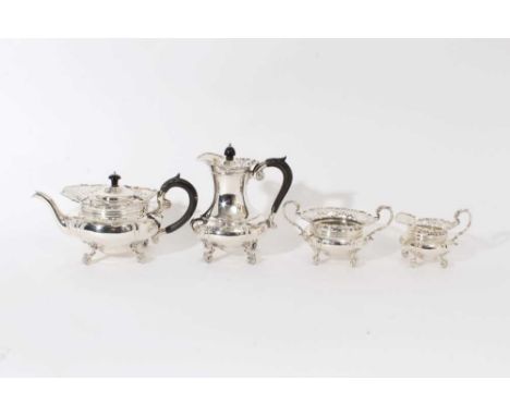 Fine quality Edwardian silver four piece tea and coffee set - comprising teapot of cauldron form, with pierced borders, raise