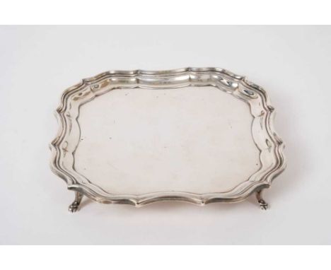 Georgian style silver card tray raised on four feet , (London 1915) 6 ozs