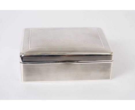 Large George V silver cigarette box of rectangular form with engine turned decoration, domed hinged cover with gilded interio