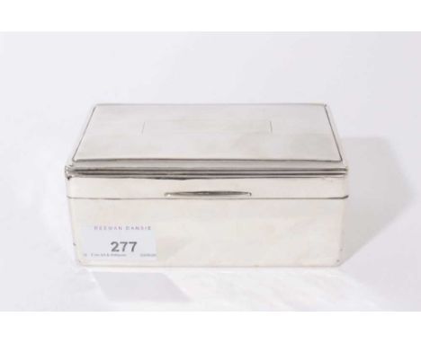 George VI silver cigarette box of rectangular form, hinged lid with engine turned decoration, opening to reveal cedar lined i