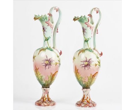 Delphin Massier ( 1836- 1907) a pair of tall Vallauris majolica ewers (2)Late 19th centuryMoulded and coloured with branches 