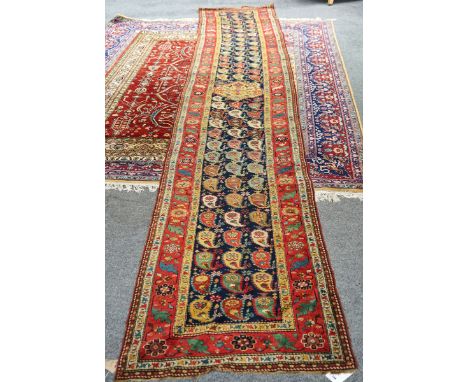 A similar Karabagh runner of matching design570xm x 100cmGenerally good condition with some holes to the bottom end, there is