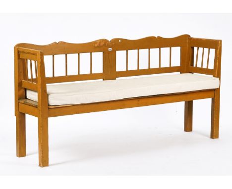 A EUROPEAN PAINTED PINE BENCHWith solid seat on block supports, 195cm wide; 95cm high