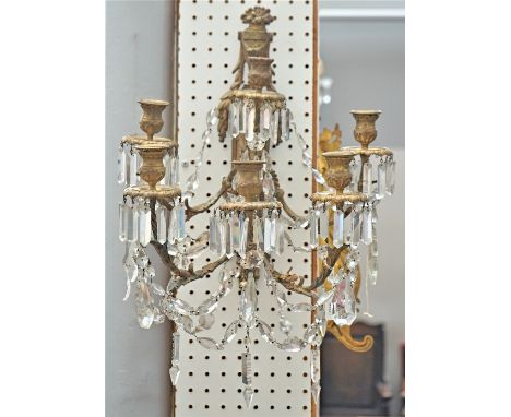 A PAIR OF EMPIRE STYLE GILT-METAL SIX-LIGHT WALL APPLIQUESLate 19th CenturyWith faceted glass hung drops, 44cm highCondition 