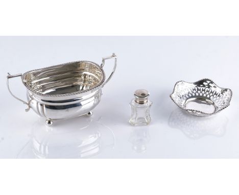 A silver twin handled sugar bowl and two further items (3)The sugar bowl decorated with a gadrooned rim and raised on four sp