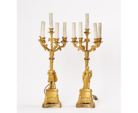 A PAIR OF LOUIS-PHILIPPE ORMOLU FIVE-LIGHT CANDELABRACirca 1840Depicting a knight and a lady in the Troubadour style, below f