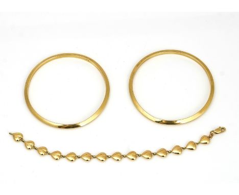 A pair of gold bangles, and a gold bracelet (3)The pair of undecorated circular bangles, each detailed 14 K, the bracelet of 