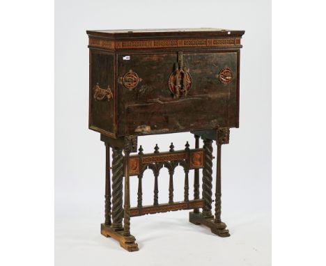 A 19TH CENTURY SPANISH IRON-MOUNTED VARGUENO ON STANDWith pierced fruit-wood friezes and side profile portrait panels of Rena