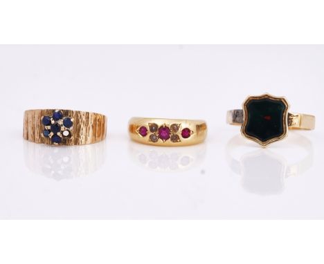 A Victorian 18ct gold, ruby and half pearl ring and two further rings (3)The ruby and half pearl ring, Chester 1895, ring siz