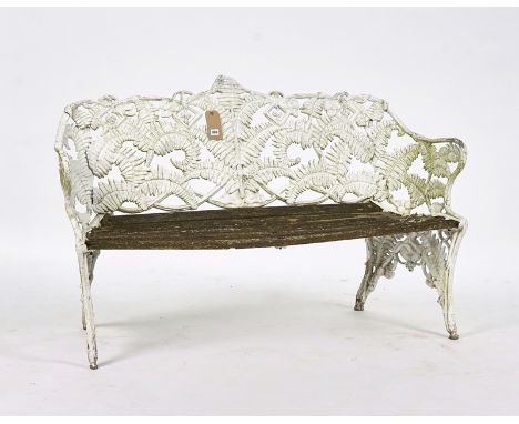 AFTER COALBROOKDALE; A WHITE PAINTED ALUMINIUM GARDEN BENCH IN THE 'FERN AND BLACKBERRY' PATTERN151cm wide; 89cm high; Togeth