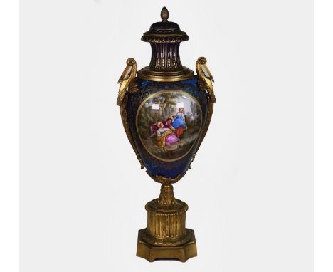 A tall Sevres-style ormolu mounted earthenware two-handled vase and coverLate 19th centuryPainted with a pastoral scene depic