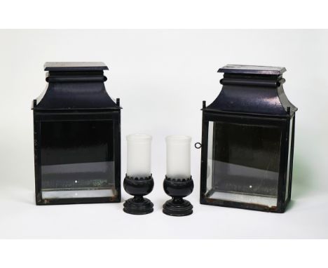 A PAIR OF BLACK TOLE PEINTE WALL LANTERNS (2)By Sibyl Colefax and John Fowler, ModernWith standing cup shaped light fitment a
