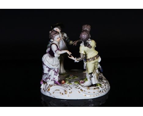 A Meissen group of dancersLate 19th/20th centuryModelled as  two boys and two girls dancing in a ring, blue crossed swords ma