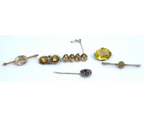 A gold brooch, collet set with a row of four oval cut citrines and five other brooches (6)A citrine two stone brooch, four fu