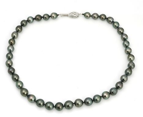 A single row of grey tinted cultured pearlsof graduated baroque design, on a  white gold clasp, detailed 14 K, length includi
