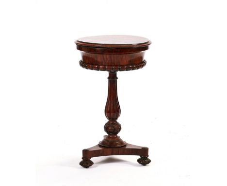 A GEORGE IV ROSEWOOD TEAPOYWith circular hinged top enclosing four caddy recesses, 47cm diameter; 77cm high