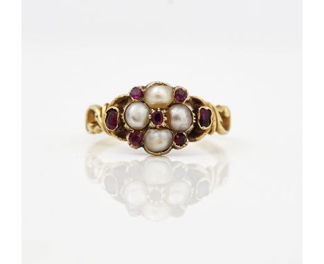 A Victorian gold, ruby and half pearl set ringMounted with four half pearls and with seven variously cut rubies, between scro