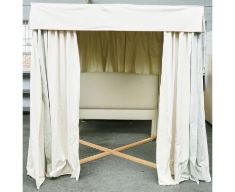 A MODERN CREAM UPHOLSTERED FOUR POSTER BED FRAME239cm wide; 251cm high; 223cm longCondition report:&nbsp;A few marks to the h