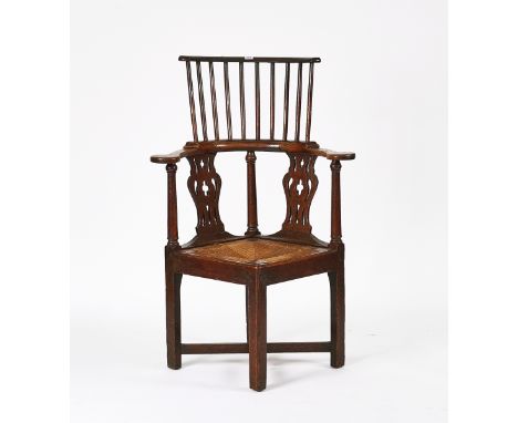 A MID-18TH CENTURY OAK DOUBLE HEIGHT CORNER CHAIROn block supports, 74cm wide; 112cm highCondition report:&nbsp;Overall, in g