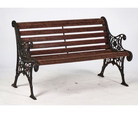 AN EARLY 20TH CENTURY BLACK PAINTED CAST-IRON BENCHWith foliate cast ends and slatted seat, 128cm wide; 78cm high