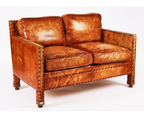 A MID-20TH CENTURY TWO-SEAT STUDDED BROWN LEATHER UPHOLSTERED SQUARE BACK SOFA141cm wide; 80cm high