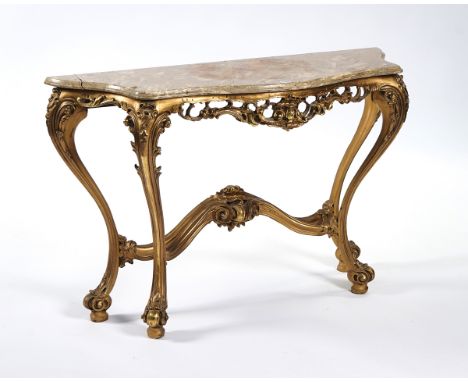 A ROCOCO STYLE GILTWOOD CONSOLE TABLEWith a polished fossil stone serpentine-shaped top, 122cm wide; 40.5cm deep; 78cm highCo