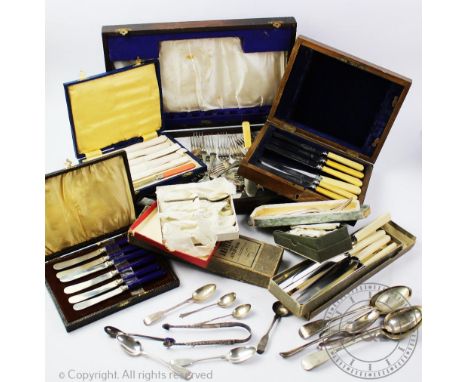 A selection of silver cutlery to include three silver teaspoons, a pair of silver sugar tongs, a silver caddy spoon and colle