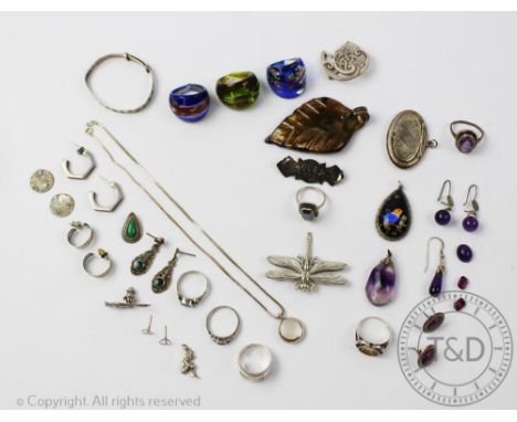 A collection of silver and silver coloured jewellery, to include; A Chester silver oval locket, rings, pendants, bracelets et