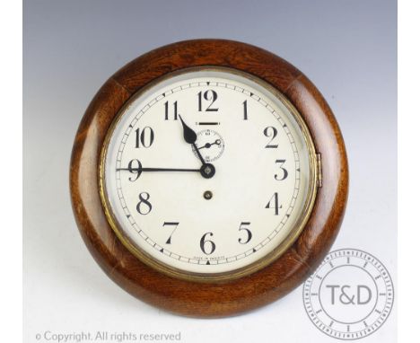 An early 20th century stained wood eight day wall time piece, Arabic dial with subsidiary seconds, 28cm diam CONDITION REPORT