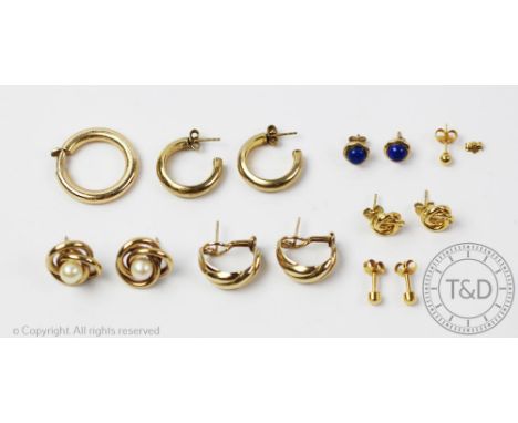 A collection of gold and gold coloured earrings, to include; a pair of 9ct gold hoops with wrythen detail, weight 6.2gms and 