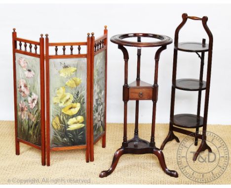 A late 19th century Aesthetic style fire screen, painted with flowers, 78cm H x 76.5cm W, with a mahogany wash stand and a fo