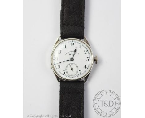 An Edwardian Sheffield Goldsmiths Co Ltd Akurit silver cased wristwatch, circular white enamel face with black Arabic numeral