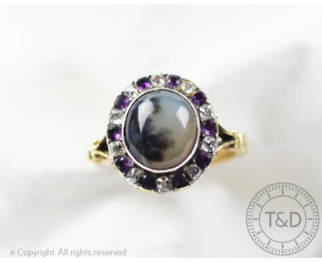 An unusual dendritic agate set ring, 19th century, the central cabochon within an amethyst and diamond set alternating surrou
