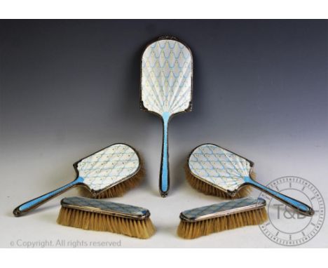 A five piece silver and enamel dressing table set, Albert Carter, Birmingham 1939/40, each decorated with pale blue and white