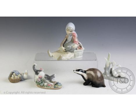 Three Lladro groups, comprising girl with turkey, kitten and frog 1442, family of ducks 4895 and a Nao group of ducks, with a