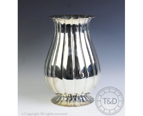 A large Continental '800' standard silver centrepiece, the vase of lobed waisted and tapering form, with moulded rims, stampe