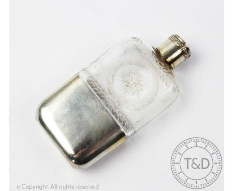 A late 19th century French silver mounted glass hip flask, of rectangular form with etched laurel wreath decoration, screw ca