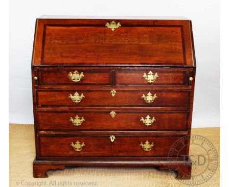 A George III oak bureau, with fall enclosing a fitted interior, over four graduated long drawers, on bracket feet, 109cm H x 