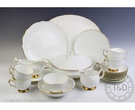 An Aynsley 'Golden Crocus' pattern dinner and tea service, comprising; six dinner plates, six entree plates, six side plates,