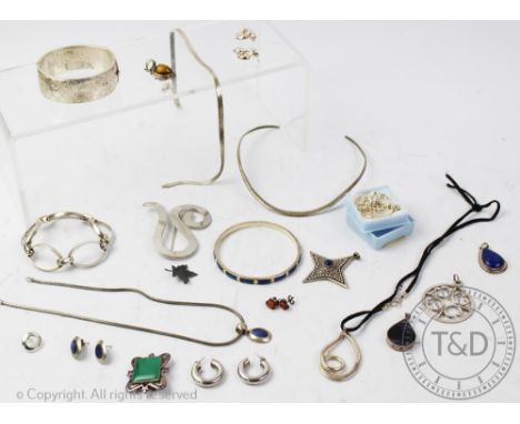 A selection of silver and white metal jewellery, to include; a bracelet designed as five oval links, a hinged bangle, a torqu