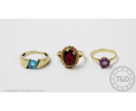 An amethyst ring in 18ct yellow gold setting, size Q, weight 2.9gms, a topaz set ring in 9ct yellow gold setting, size R, wei